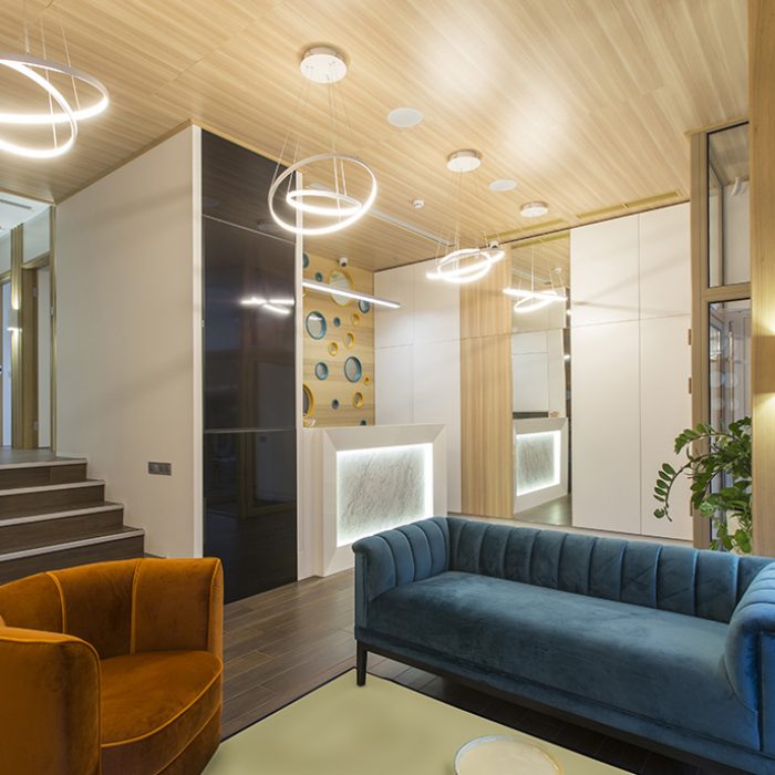 Waiting area for children with parents in empty dentistry, interior with no people, copy space