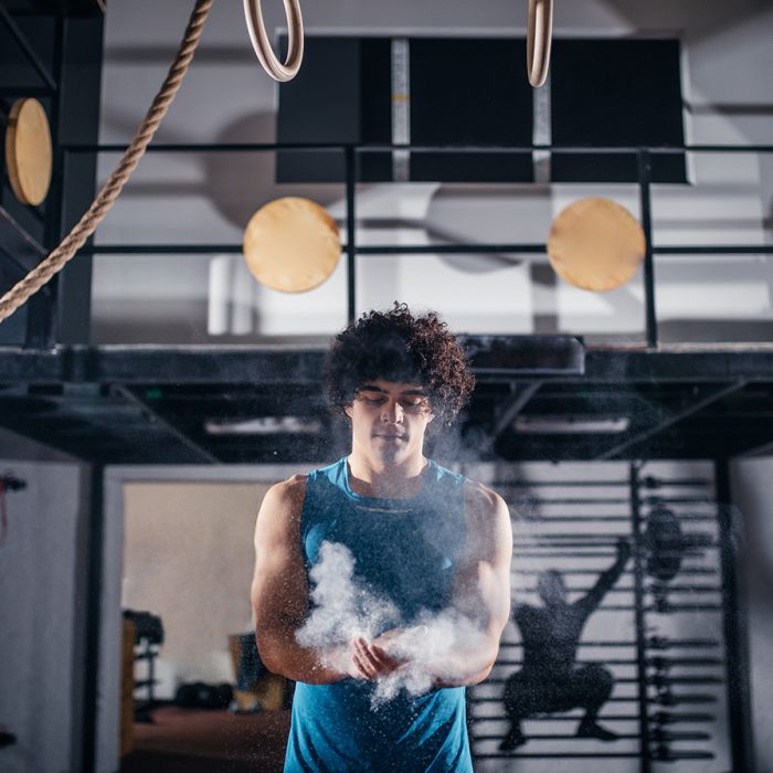 Portrait of a handsome man getting ready for a workout in the gym.