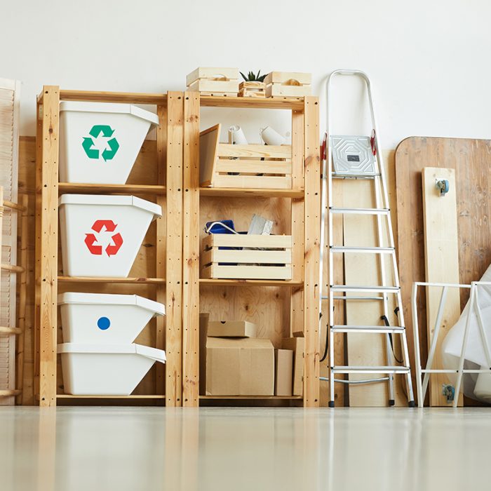 Image of trash bins on the wooden shelves in the warehouse