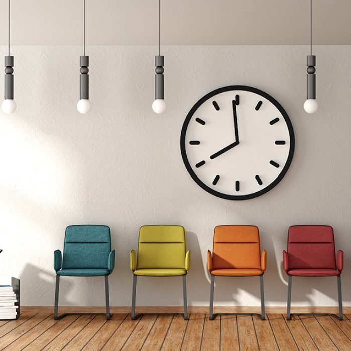 Waiting room with colorful chairs on white wall with big clock - 3d rendering