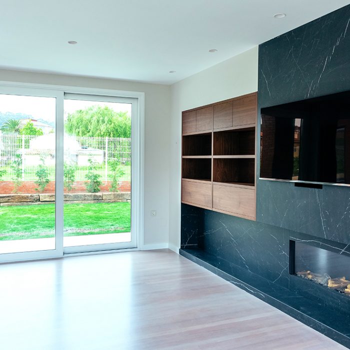 Large living room empty with fireplace and TV